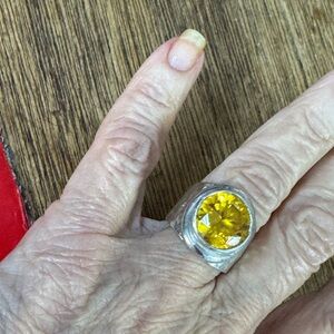 Radiant Silver Ring with Golden Yellow Gemstone